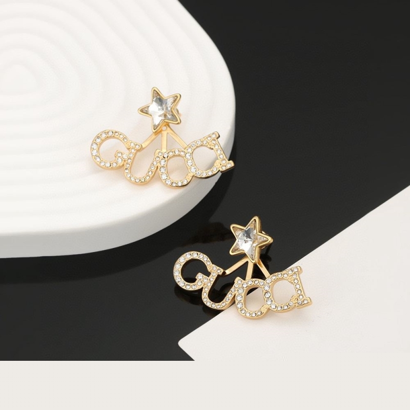 G*u*i earrings